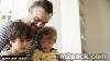 close up of father and sons reading story at home